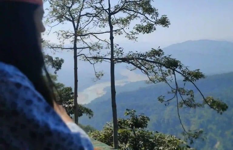A woman looking at the mountains.
