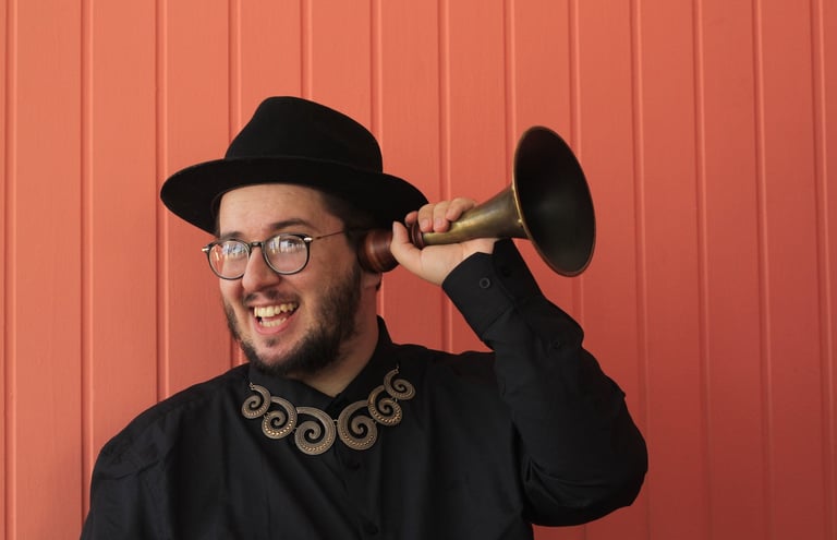 a man in a black hat and a black hat with a horn horn horn