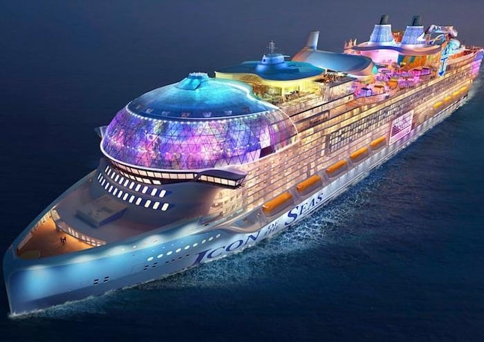 a cruise ship with a large cruise ship in the water