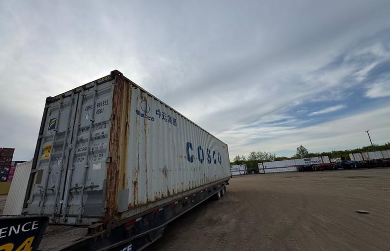Tilt-bed roll-off delivering a 40ft storage container near Toronto