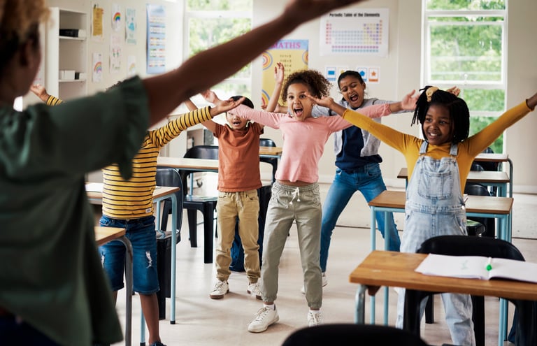 Students doing physical movement in the classroom.