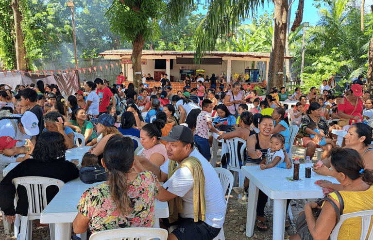 A large crowd of people gathering at the Mothers Day Celebration organized by Roger Bardales