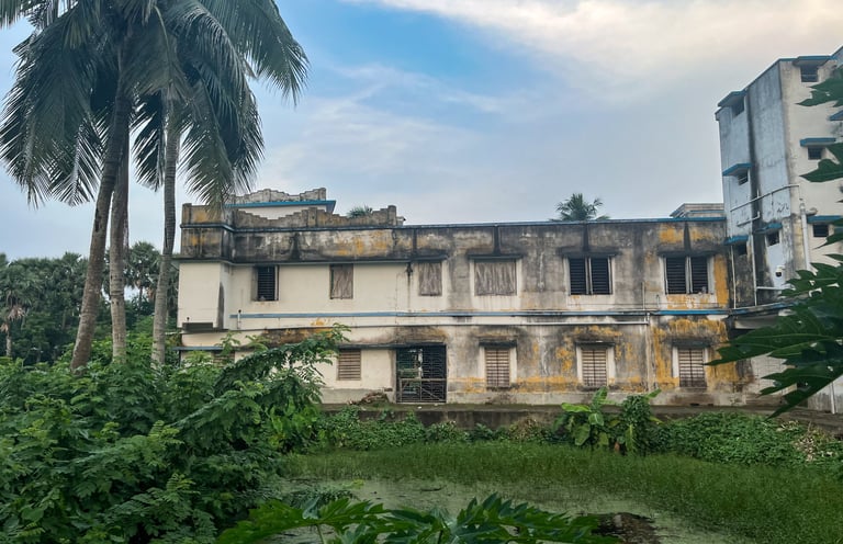 Kalidaha Gohaldaha R.M. High. with pond and trees.