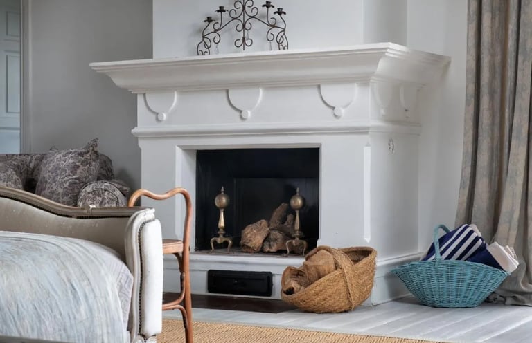Fireplace with baskets and decor at Finca Santa Katerina