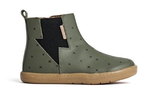 Product photography - a green boot with a black lightning strike