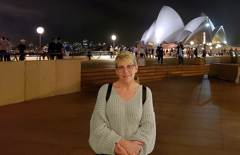 Lady Michelle with the Opera House behind her in Sydney, Australia