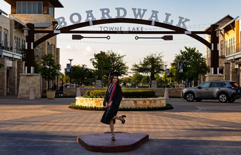 Graduation portrait taken of a young woman at The Boardwalk of Towne Lake, Cypress, TX