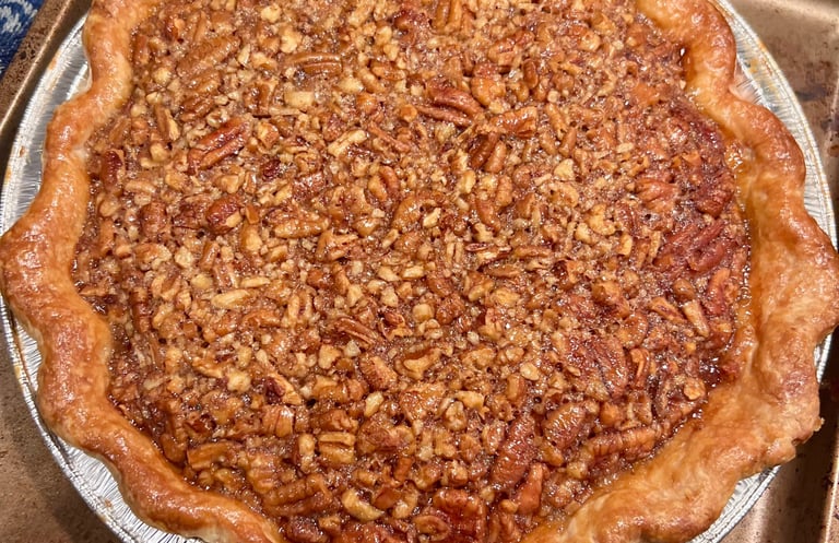 Blue Ribbon Classic Pecan Pie with toasted pecans baked in a flaky butter-lard crust.
