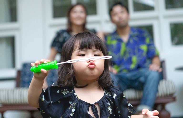 Child blowing bubbles during JW Marriott Phu Quoc photoshoot