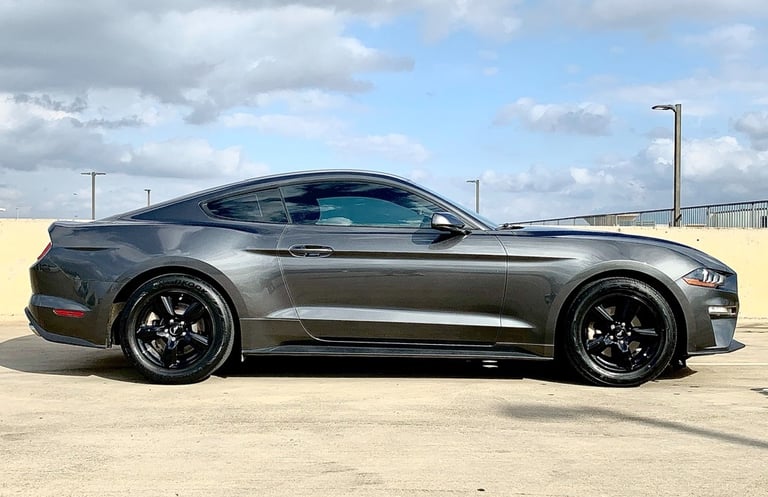 a mustang GT in a parking lot