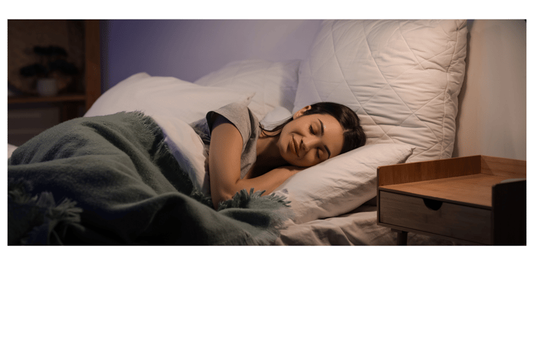 Woman sleeping contently on a grounding sheet