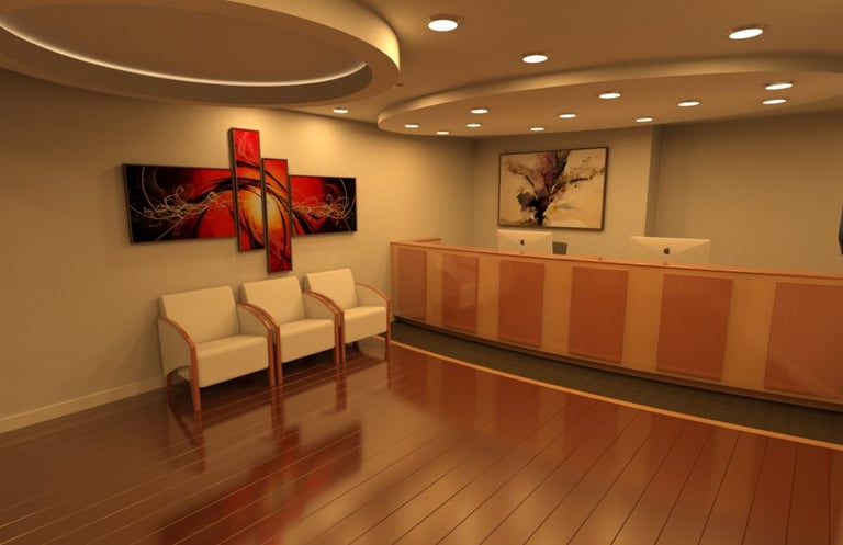 Modern lobby with maple wood flooring, curved reception desk, split-level ceiling, recessed lights.