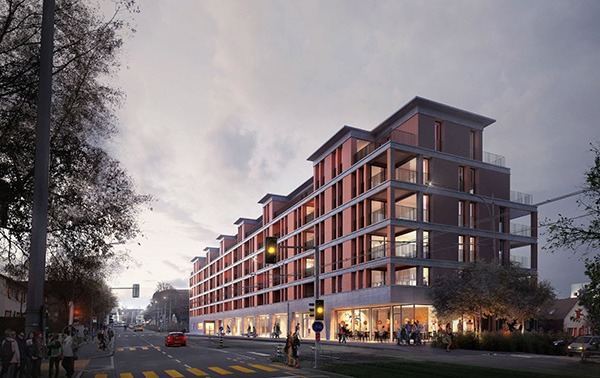Six-story apartment building with retail on the ground floor, earthy red and brown tones.