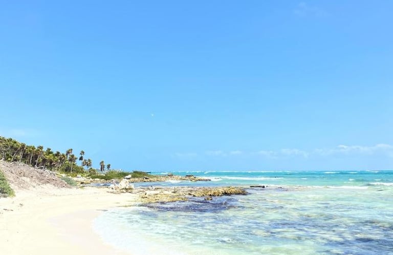 white  sandy beach providing a peaceful space to enjoy nature during yoga and meditation retreats for women