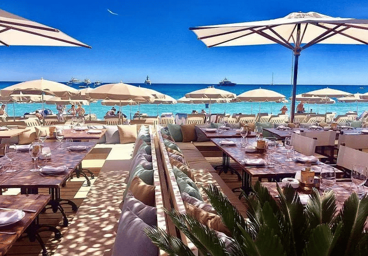 Beach in Cannes with restaurant and parasol