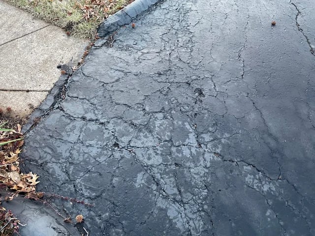 Driveway that is well past due the need for a fresh seal coat