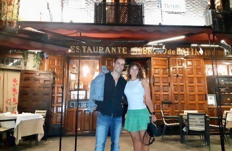 Couple standing in front of Sobrino de Botin, The Worlds Oldest Restaurant, Madrid