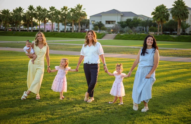 Extended family walking together outdoors during a sunset portrait session in Mesa, Arizona.