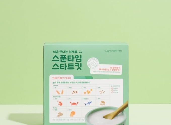 a box of rice pudding with a wooden spoon and a wooden spoon