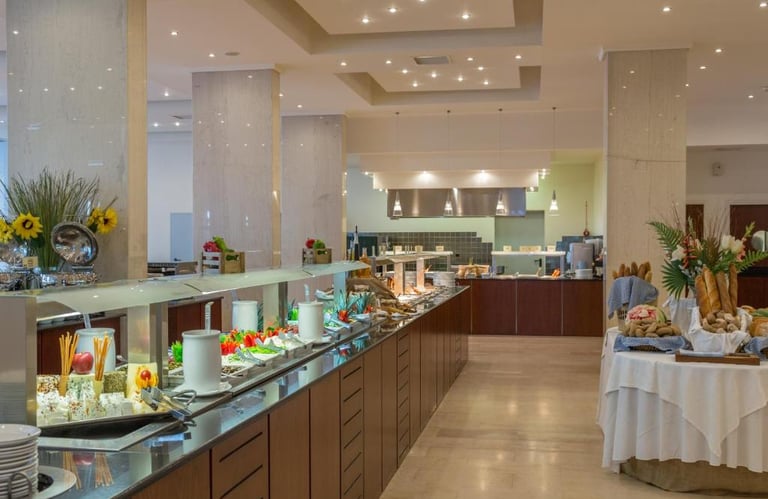 Luxury hotel breakfast buffet featuring a variety of fresh food, cheeses, and breads.