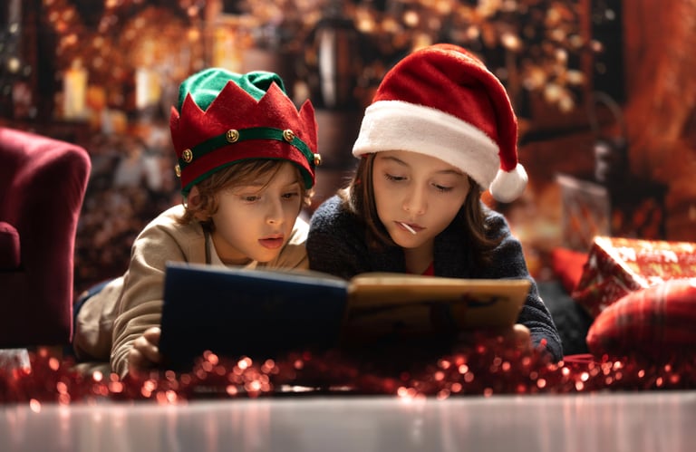 two children in santa hats and santa claus hat