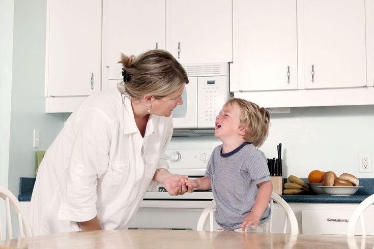 Mother comforts her son
