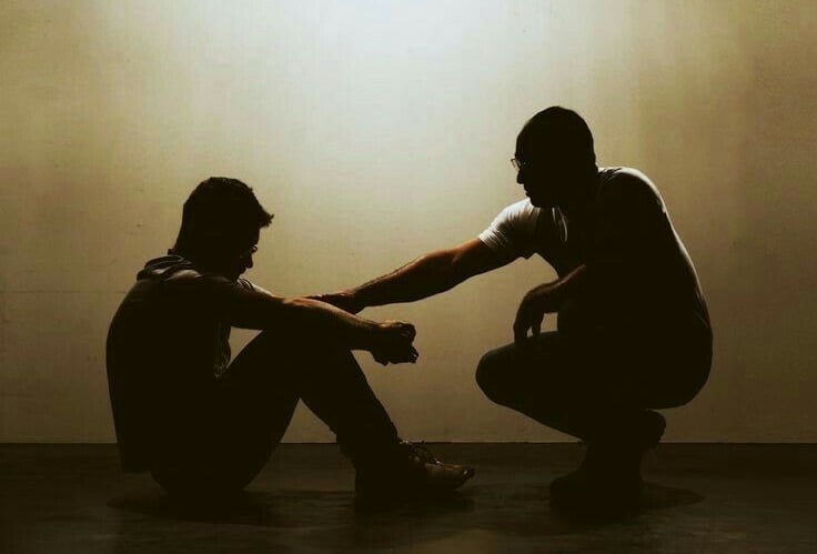 man talks with another