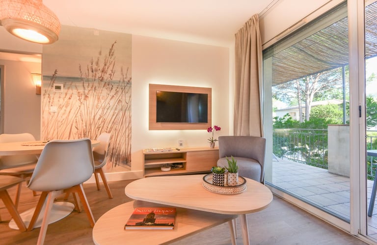 a living room with a table and chairs