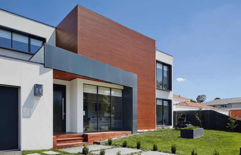 a house with a large backyard area and a large lawn