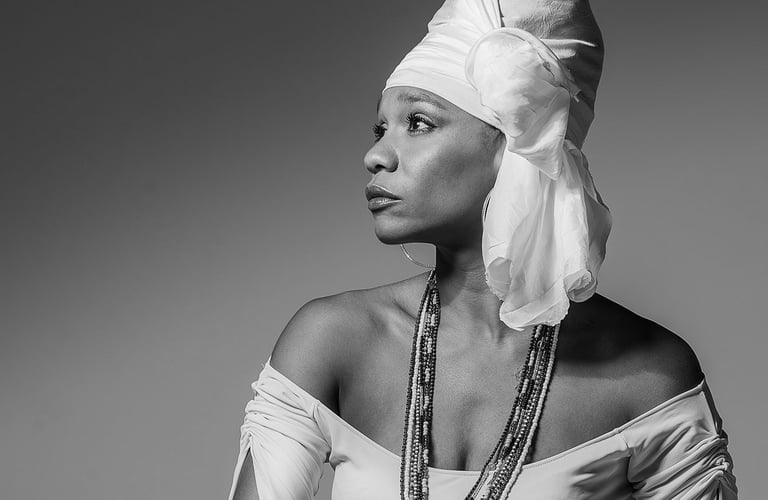 a woman in a white dress and a white head scarf