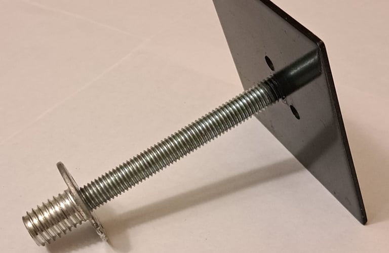 Metal anchor bolt with square plate for structural support in renovation and framing projects