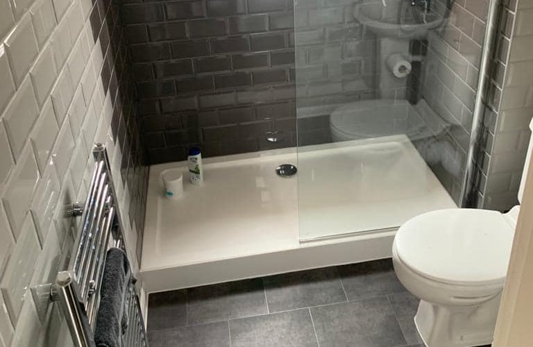 Shower fitting service provided by AXM Plumbing Services in Hereford