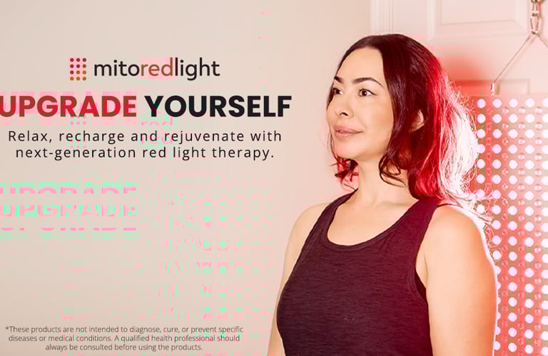 a woman with red hair and a black tank top