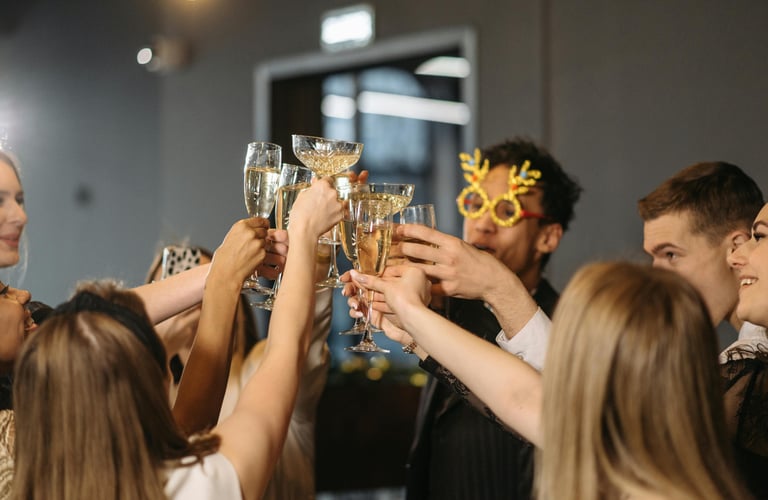 a group of people holding glasses of champagne