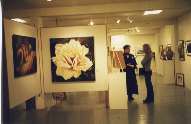 Sandra Forzani talking with a customer in a gallery