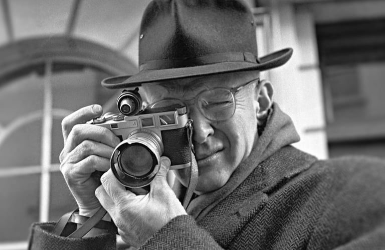 Henri Cartier-Bresson with his Leica