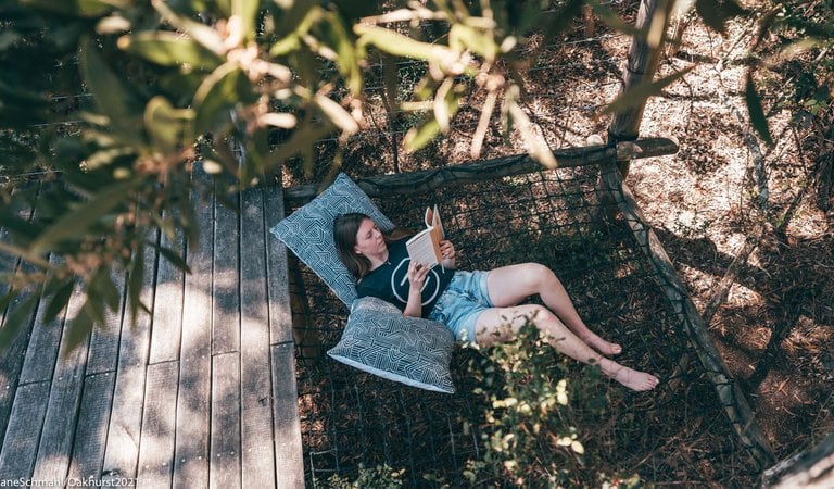 person reading a book on a retreat