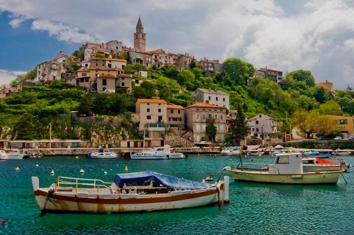 boats in the water near a small town