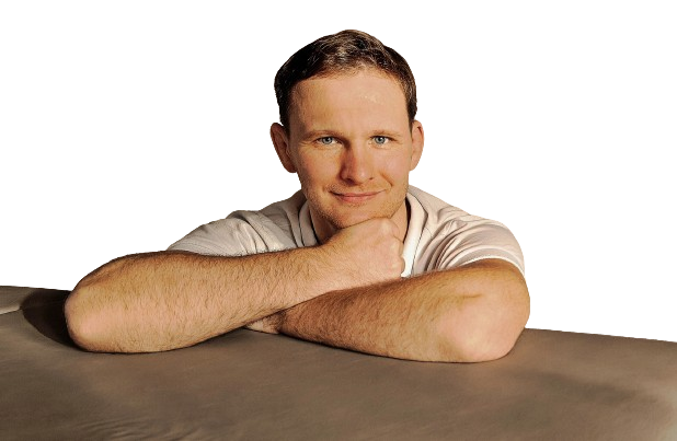 a massage therapist with a white shirts