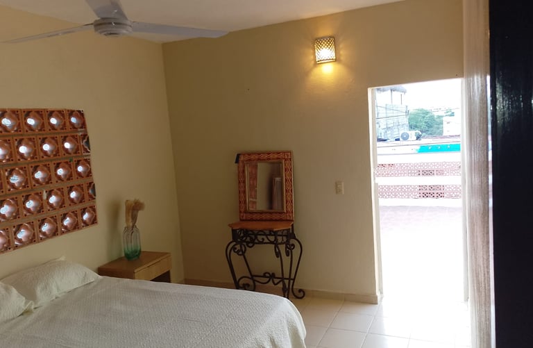 Bedroom door leads to private, expansive terrace