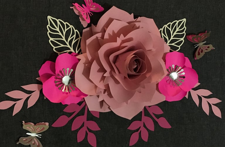 a paper flower with butterflies and butterflies