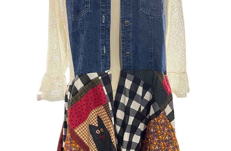 a woman's duster with a patchwork design bottom and denim and lace top
