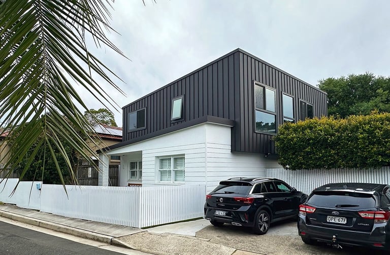 Award-winning Sydney architecture blending brutalist geometry with coastal Hampton-style warmth.