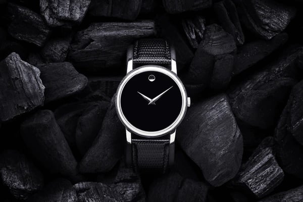 a black and white watch with a black and white watch face