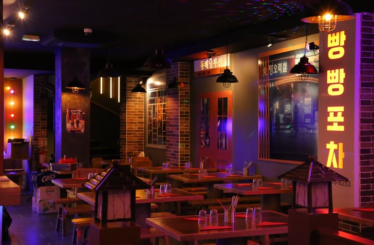 a korean restaurant with a large table and chairs