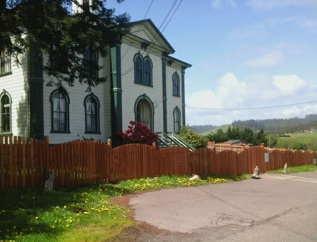 House with a fence and blue sky