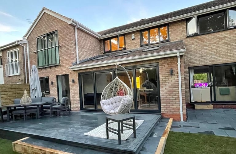Builders in Malvern constructing a modern home extension with patio doors