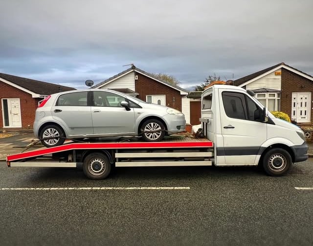 a tow truck towing a car