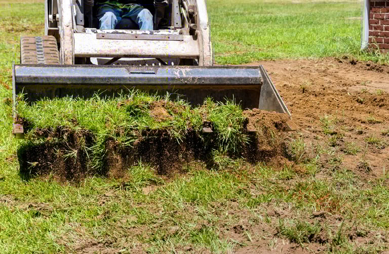 skid-steer-bucket-hauling-dirt.png