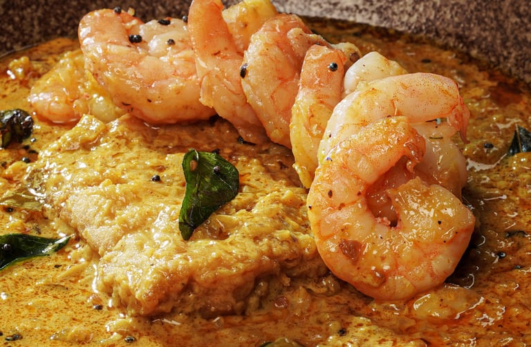 a bowl of food with shrimp and vegetables